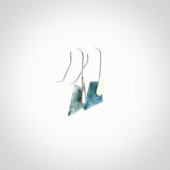 These are a pair of beautiful Aotea Stone and sterling silver earrings. It is carved from Aotea Stone from New Zealand. It is a light blue and white colour with sterling silver. Hand made here in New Zealand by Ana Krakosky.