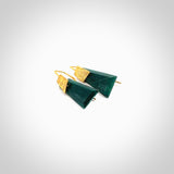 These are a pair of beautiful Goodletite Stone and gold leaf earrings. It is carved from Goodletite, ruby rock, Stone from New Zealand. It is a deep green colour with gold leaf. Hand made here in New Zealand by Ana Krakosky.
