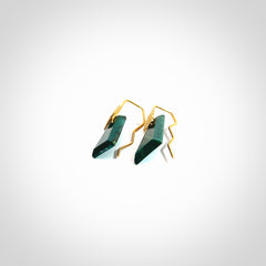 These are a pair of beautiful Goodletite Stone and gold leaf earrings. It is carved from Goodletite, ruby rock, Stone from New Zealand. It is a deep green colour with gold leaf. Hand made here in New Zealand by Ana Krakosky.