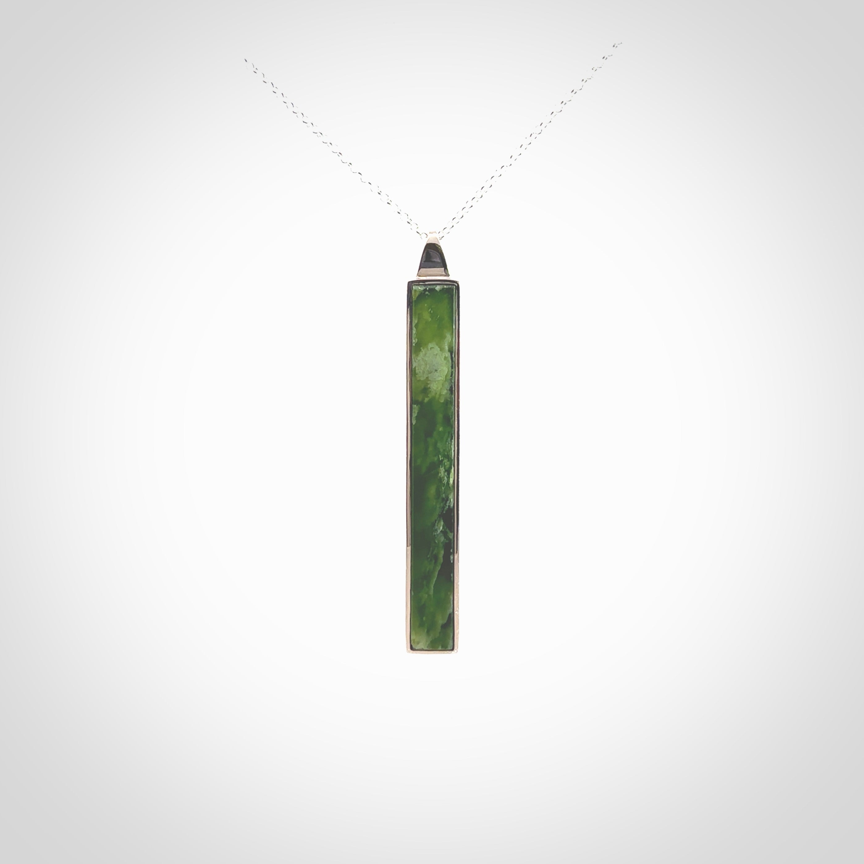 Hand carved New Zealand jade drop pendants with Sterling Silver. Contemporary drop necklaces that are hand made and will make fashionable statements around your neck. These beautiful Jade drops are in a sterling silver encasing. For sale by NZ Pacific and shipped free worldwide.