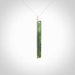 Hand carved New Zealand jade drop pendants with Sterling Silver. Contemporary drop necklaces that are hand made and will make fashionable statements around your neck. These beautiful Jade drops are in a sterling silver encasing. For sale by NZ Pacific and shipped free worldwide.