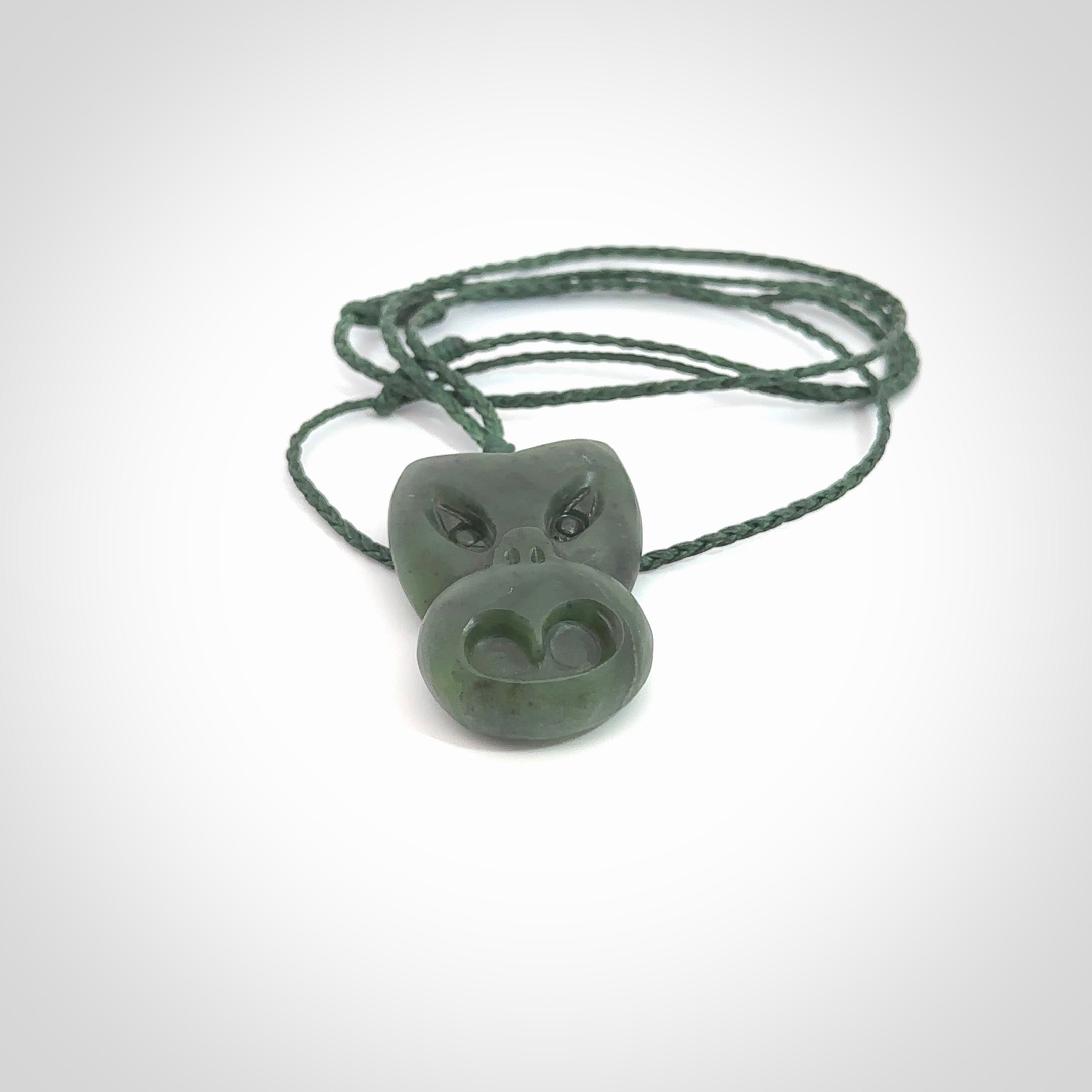 Hand carved New Zealand Jade Pounamu Wheku face pendant. Carved from New Zealand Jade by NZ Pacific. Hand crafted Jade jewellery for sale online. Pacific carving pendant, striking and unique delivered to you with Express Courier at no extra cost.