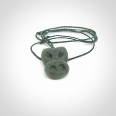 Hand carved New Zealand Jade Pounamu Wheku face pendant. Carved from New Zealand Jade by NZ Pacific. Hand crafted Jade jewellery for sale online. Pacific carving pendant, striking and unique delivered to you with Express Courier at no extra cost.