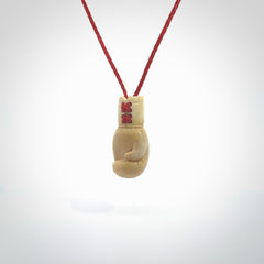 Hand carved boxing glove made from deer antler. The cord is adjustable so that you can wear this where it suits you best.