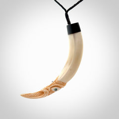 Hand carved Boars Tusk pendant with Buffalo horn, Paua Shell and Brass. Engraved large boars tusk pendant. Unisex necklace hand carved by Andrew Doughty here in New Zealand. Unique art to wear. Delivered with an adjustable black cord.