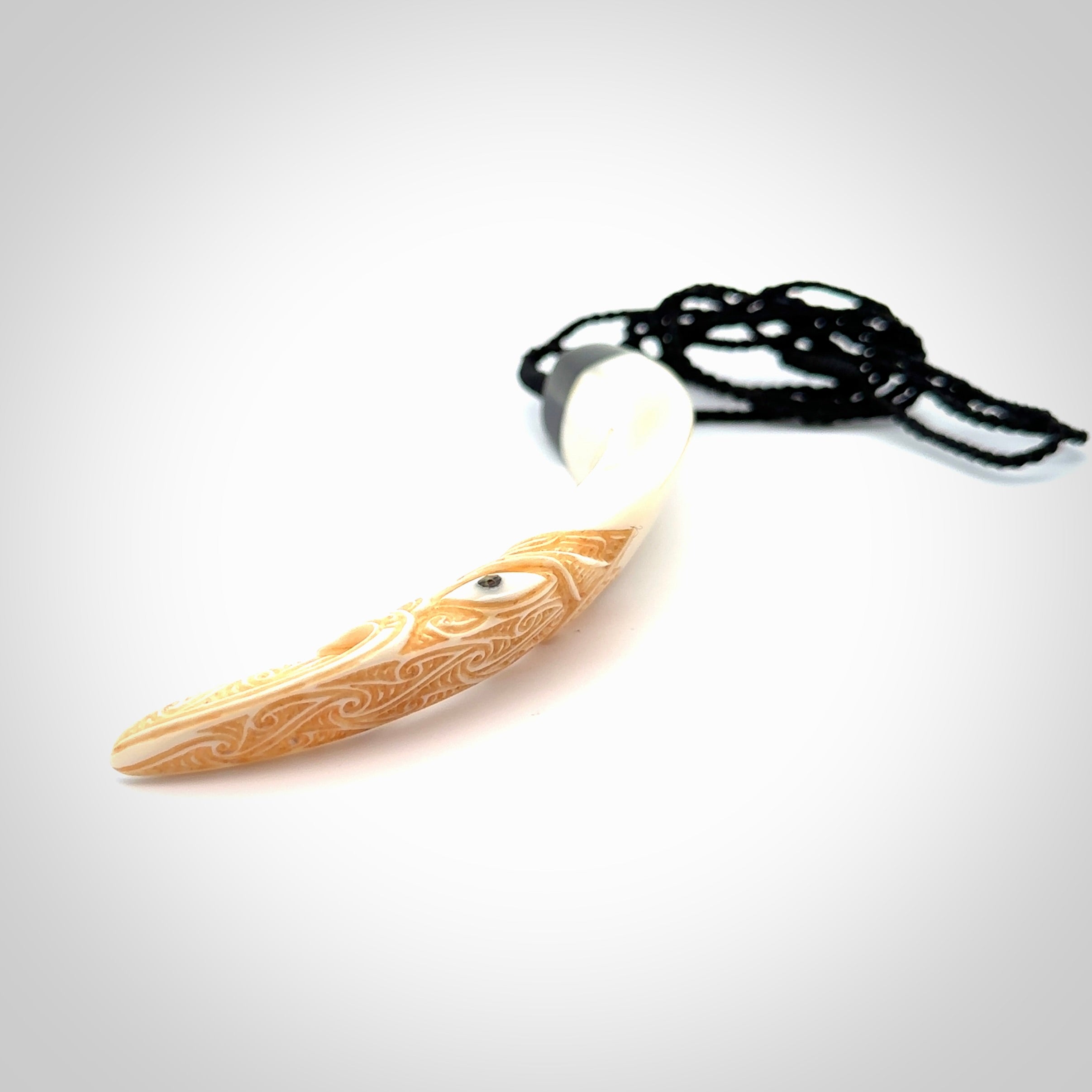 Hand carved Boars Tusk pendant with Buffalo horn, Paua Shell and Brass. Engraved large boars tusk pendant. Unisex necklace hand carved by Andrew Doughty here in New Zealand. Unique art to wear. Delivered with an adjustable black cord.