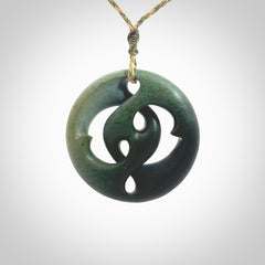 Hand carved New Zealand jade, complex twist drop pendant. Hand made complex twist pendant hand carved in New Zealand. Made by NZ Pacific, jade jewellery for sale online. One only hand made by Kerry Thompson.