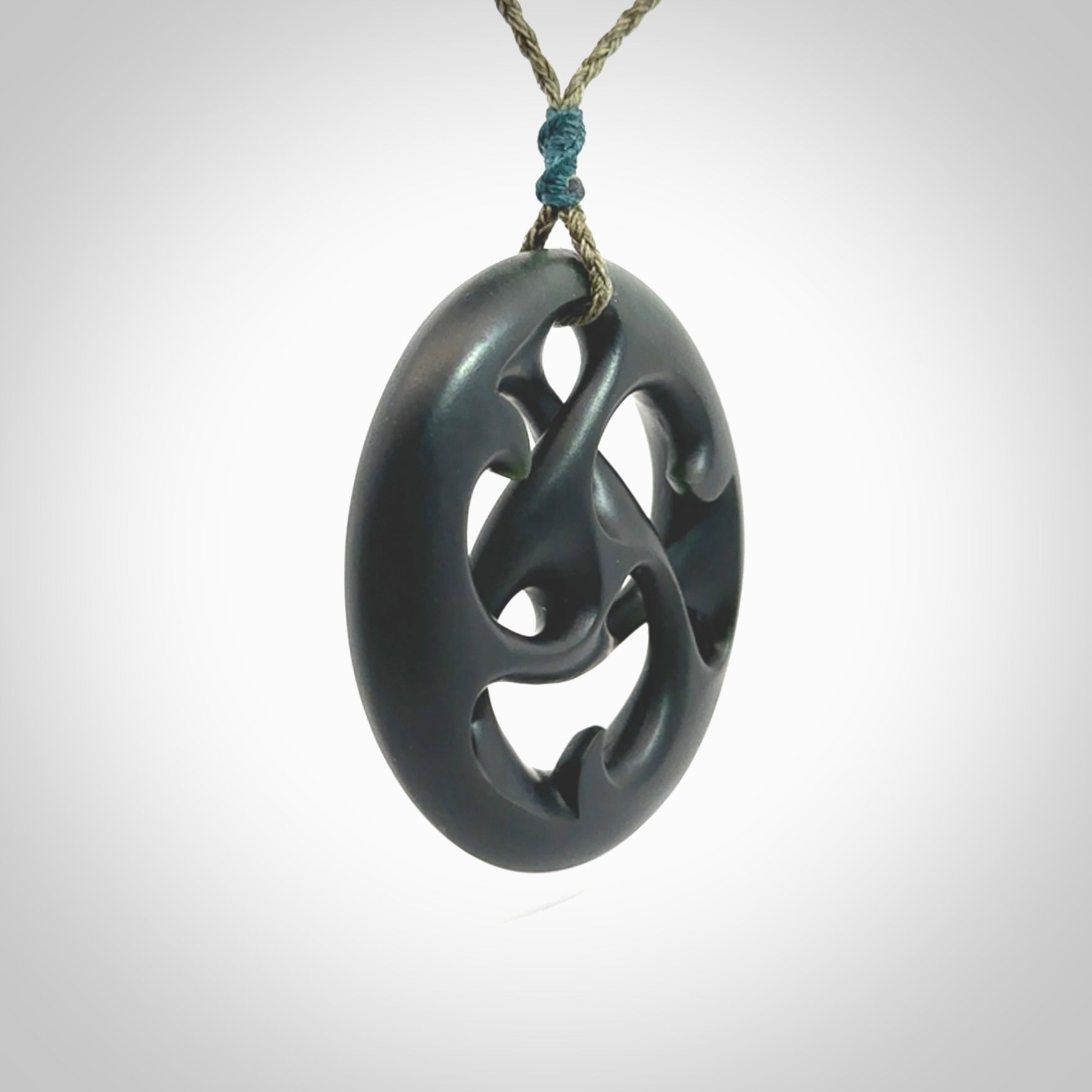 Hand carved New Zealand jade, complex twist drop pendant. Hand made complex twist pendant hand carved in New Zealand. Made by NZ Pacific, jade jewellery for sale online. One only hand made by Kerry Thompson.