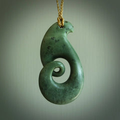 A hand carved koru pendant from New Zealand Jade. The cord is a tan colour and is adjustable. A large hand made Koru necklace by New Zealand artist Kerry Thompson.