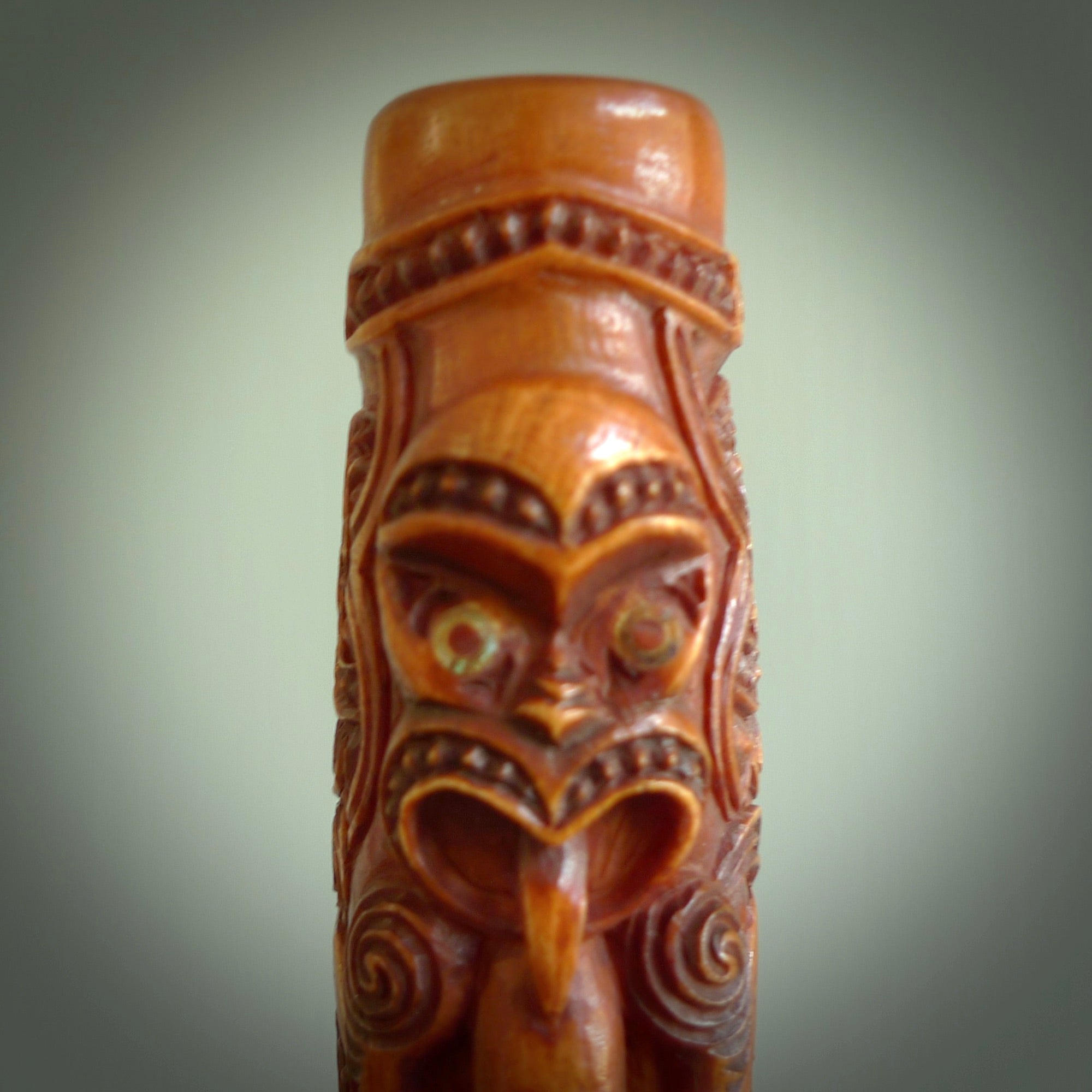 A traditional hand carved Māori Kōauau flute. This piece is made from bone and is a fully functioning musical instrument and can be played. Beautiful ethnic art hand made by NZ Pacific. One only traditional flute by Yuri Terenyi.