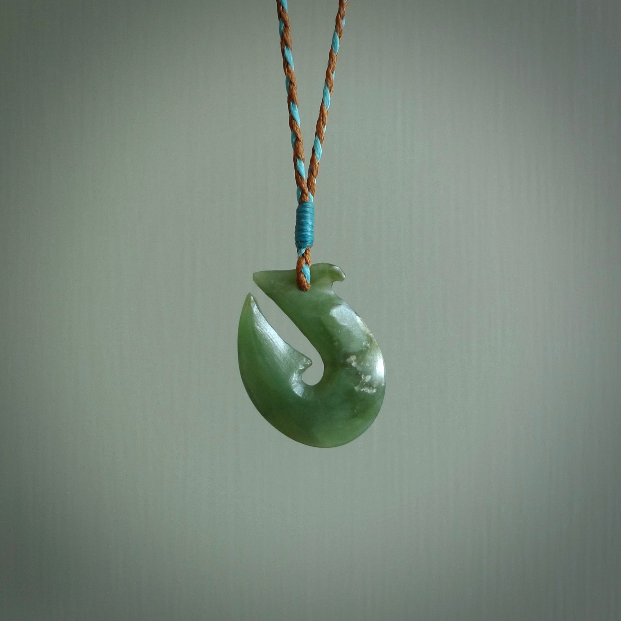 Hand carved New Zealand Jade Hook Pendant. Maori matau necklace hand carved.