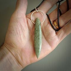 A photo of a New Zealand Jade drop pendant with sterling silver. This is a stylish statement piece - hand crafted here in New Zealand by Ana Krakosky. Unique Art to Wear. Gifts for all lovers of hand made Art to Wear.