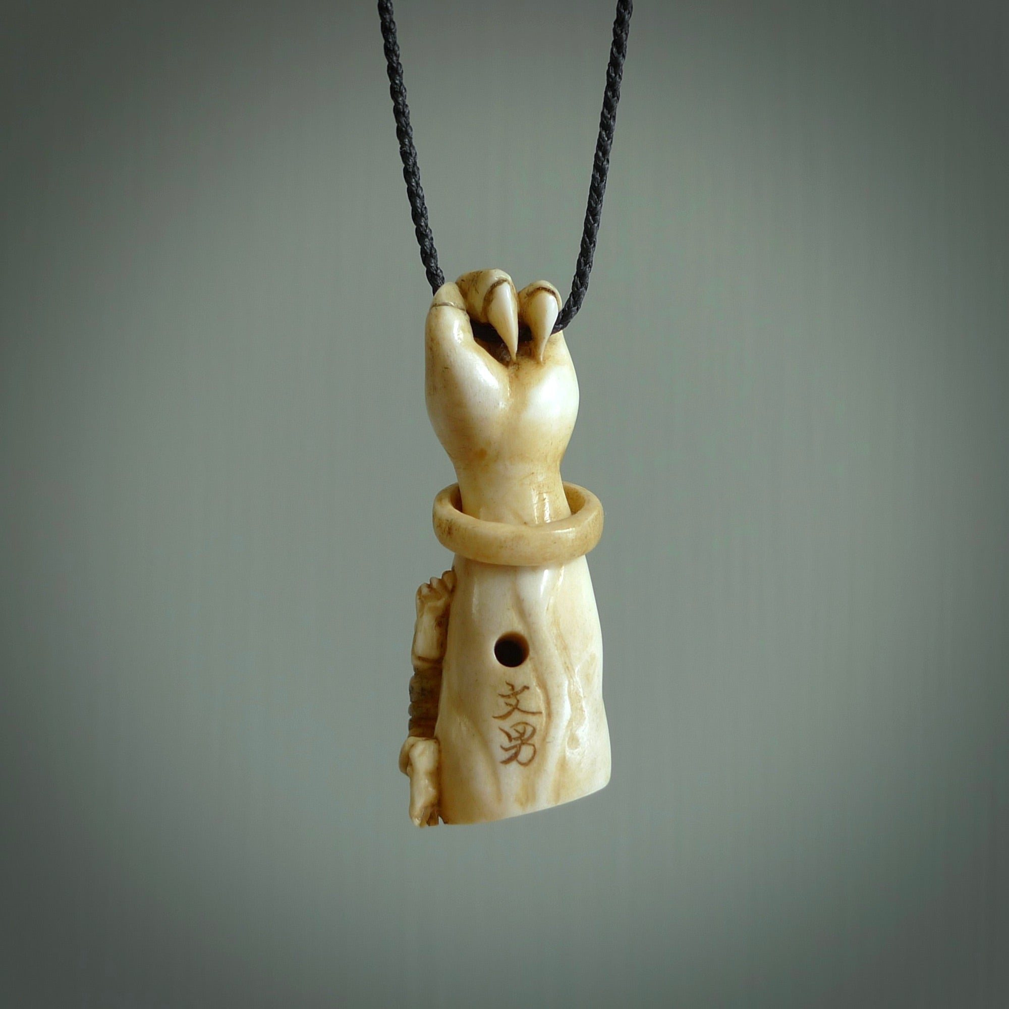 Hand carved Rashōmon Pendant. Made from Red Deer antler in New Zealand. Unique Japanese necklace hand made from deer antler by master bone carver Fumio Noguchi. Spectacular collectable work of art, made to wear. One only pendant, delivered to you at no extra cost with express courier.