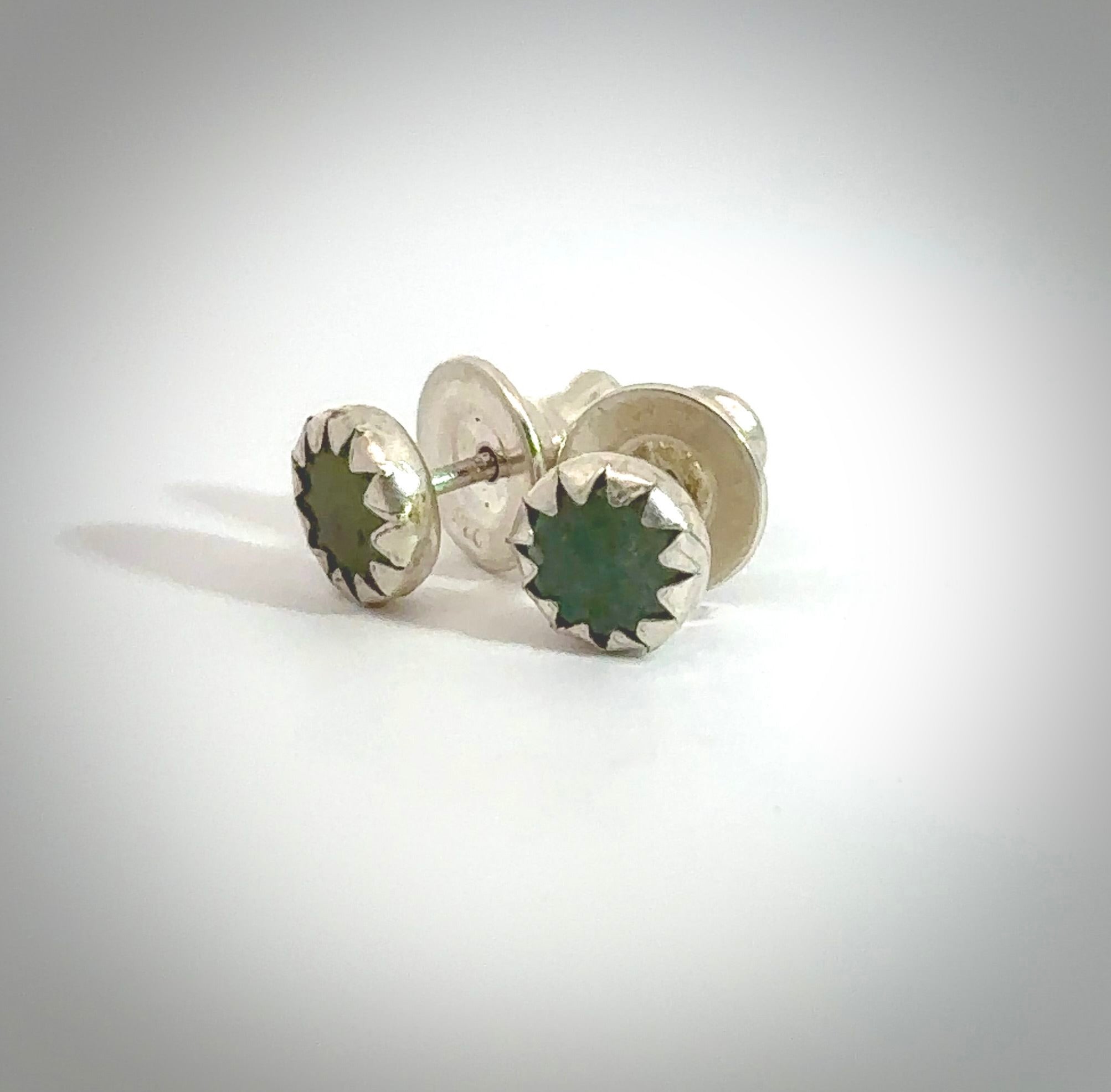 Hand carved small New Zealand Jade stud earrings. Made by NZ Pacific from NZ Garnet. Online jewellery for sale online by NZ Pacific.