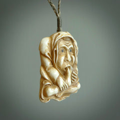 Hand carved incredible stained bone gargoyle face carving. A stunning work of art. This pendant was hand carved in bone with buffalo horn inlay for the eyes by Yuri Terenyi. A one off collectors item that has been hand crafted to be worn or displayed.