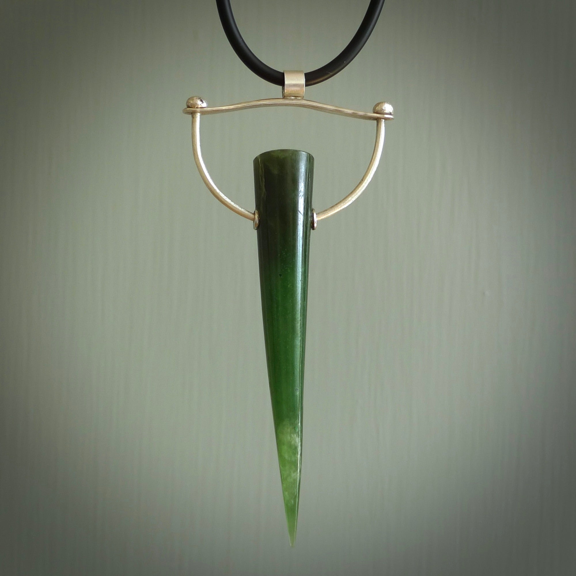 A photo of a New Zealand Jade drop pendant with sterling silver. This is a stylish statement piece - hand crafted here in New Zealand by Ana Krakosky. Unique Art to Wear. Gifts for all lovers of hand made Art to Wear.