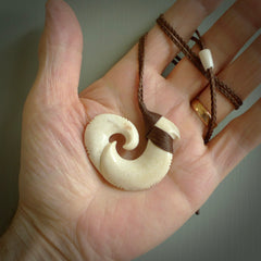 This is a wonderful, etched koru from Deer Antler. Hand carved by Anthony Bray-Heta. Order yours now on NZ Pacific at www.nzpacific.com