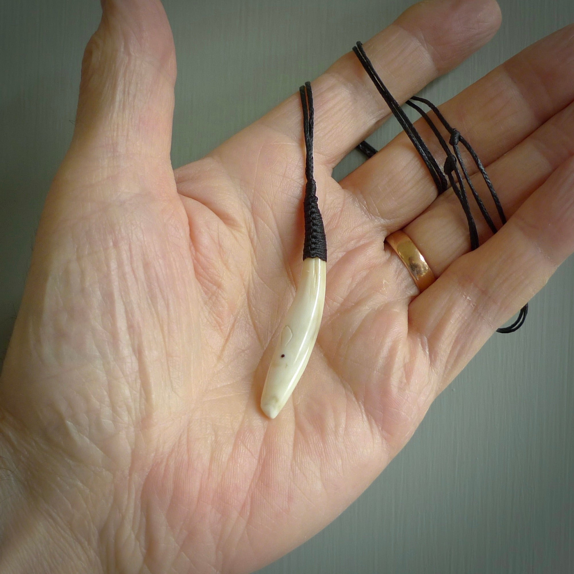 Hand carved sperm whale pendant, carved for us by Fumio Noguchi. This piece is carved from bone and is a fantastic depiction of these giants of the deep. This particular piece is a sperm whale design and is lovingly carved. Free shipping worldwide.