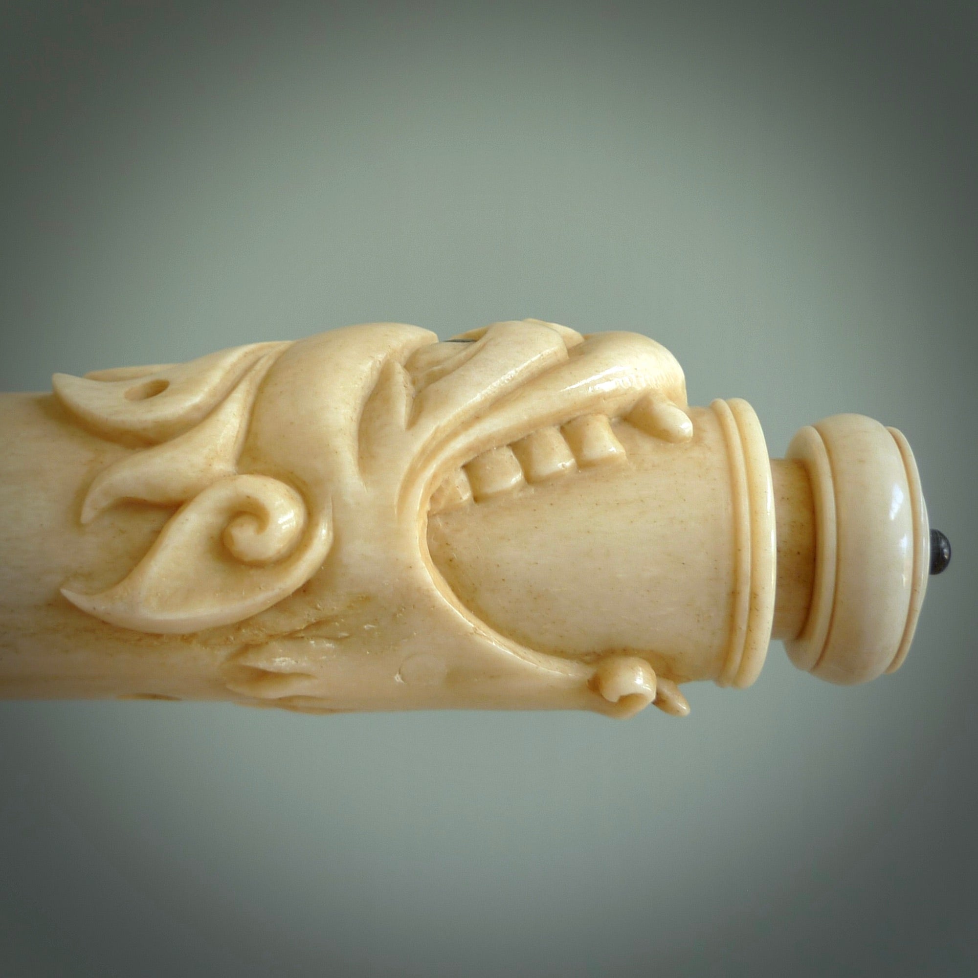 A contemporary hand carved flute. This piece is made from bone and is a fully functioning musical instrument and can be played. Beautiful art hand made by Yuri Terenyi. Flute with Dragons head.