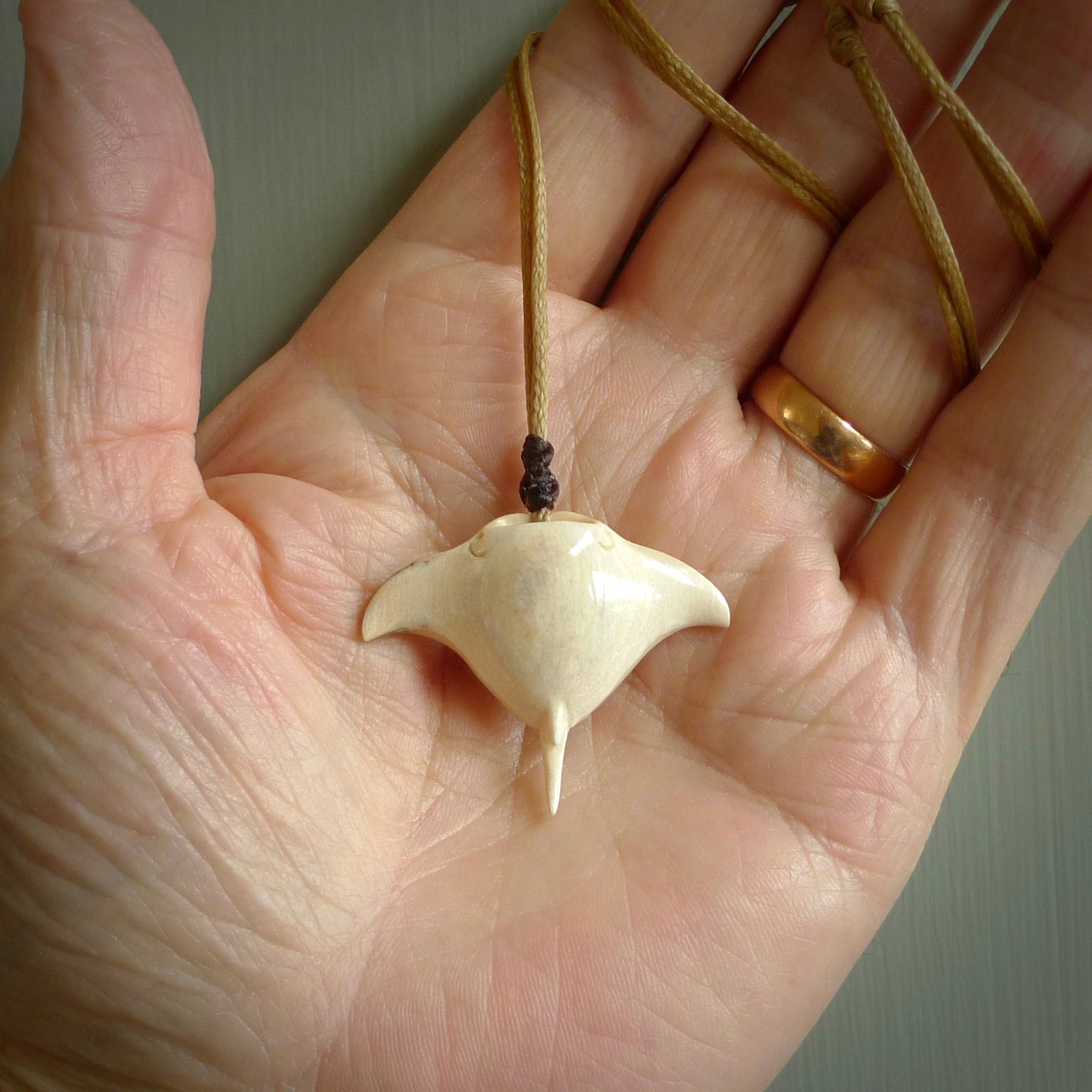 Woolly mammoth tusk manta ray pendant. Hand carved Mammoth Tusk manta ray pendant. Provided with adjustable cord.