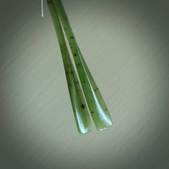 This picture shows hand carved New Zealand Jade, Pounamu paddle shaped, drop earrings. Delivery is free worldwide. NZ made Jade earrings. One pair only hand carved by New Zealand artist, Nicola Rees.