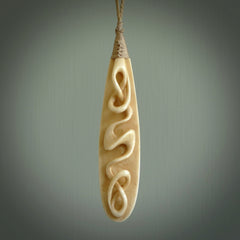 A handcarved masterpiece. A complex twist pendant carved from bone by Yuri Terenyi for NZ Pacific. This is a true piece of wearable art which is collectible. A one-off masterpiece and quite unique. Delivered with Express Courier and gift wrapped in a woven kete pouch.