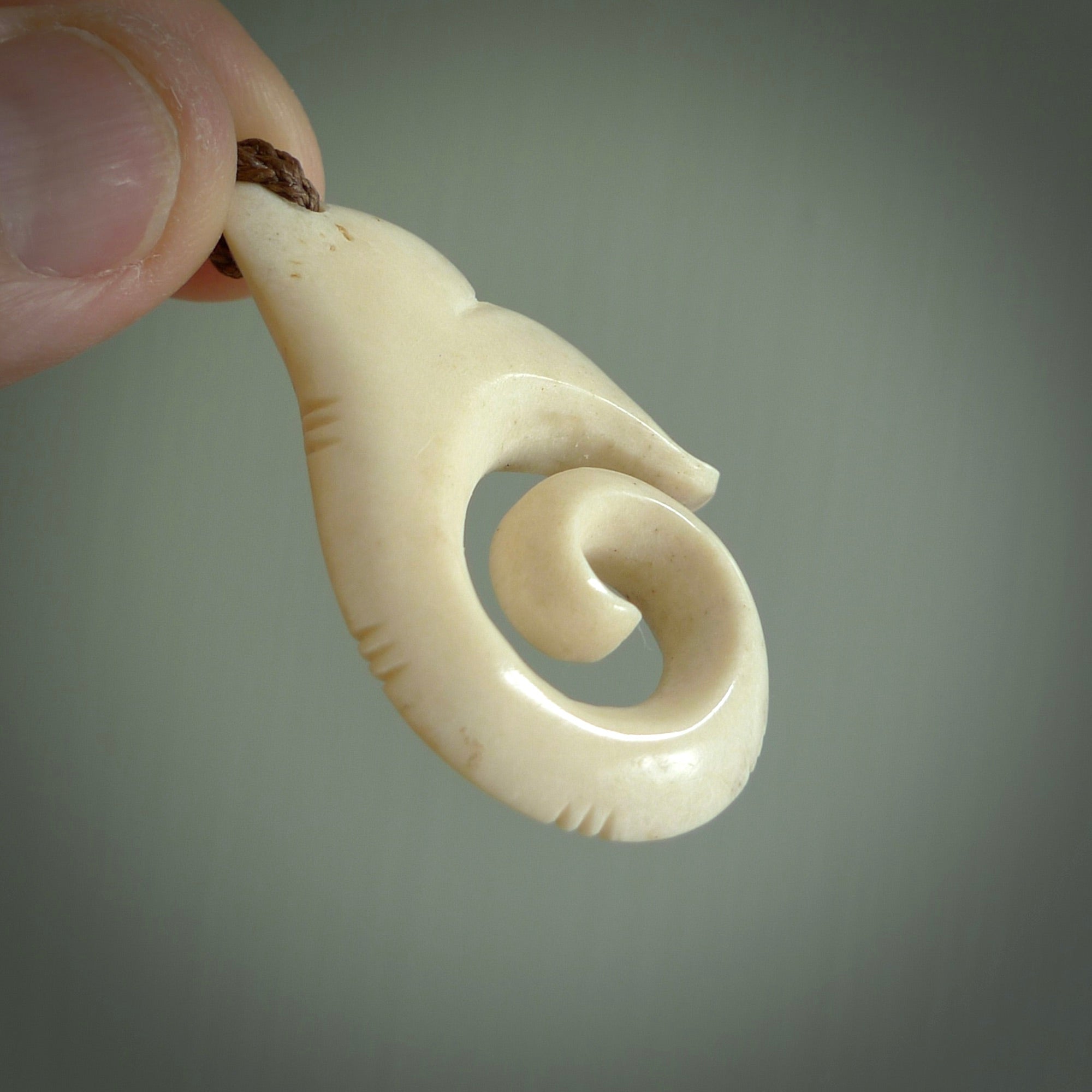 This is a wonderful, etched koru with whale tail from Deer Antler. Hand carved by Anthony Bray-Heta. Order yours now on NZ Pacific at www.nzpacific.com