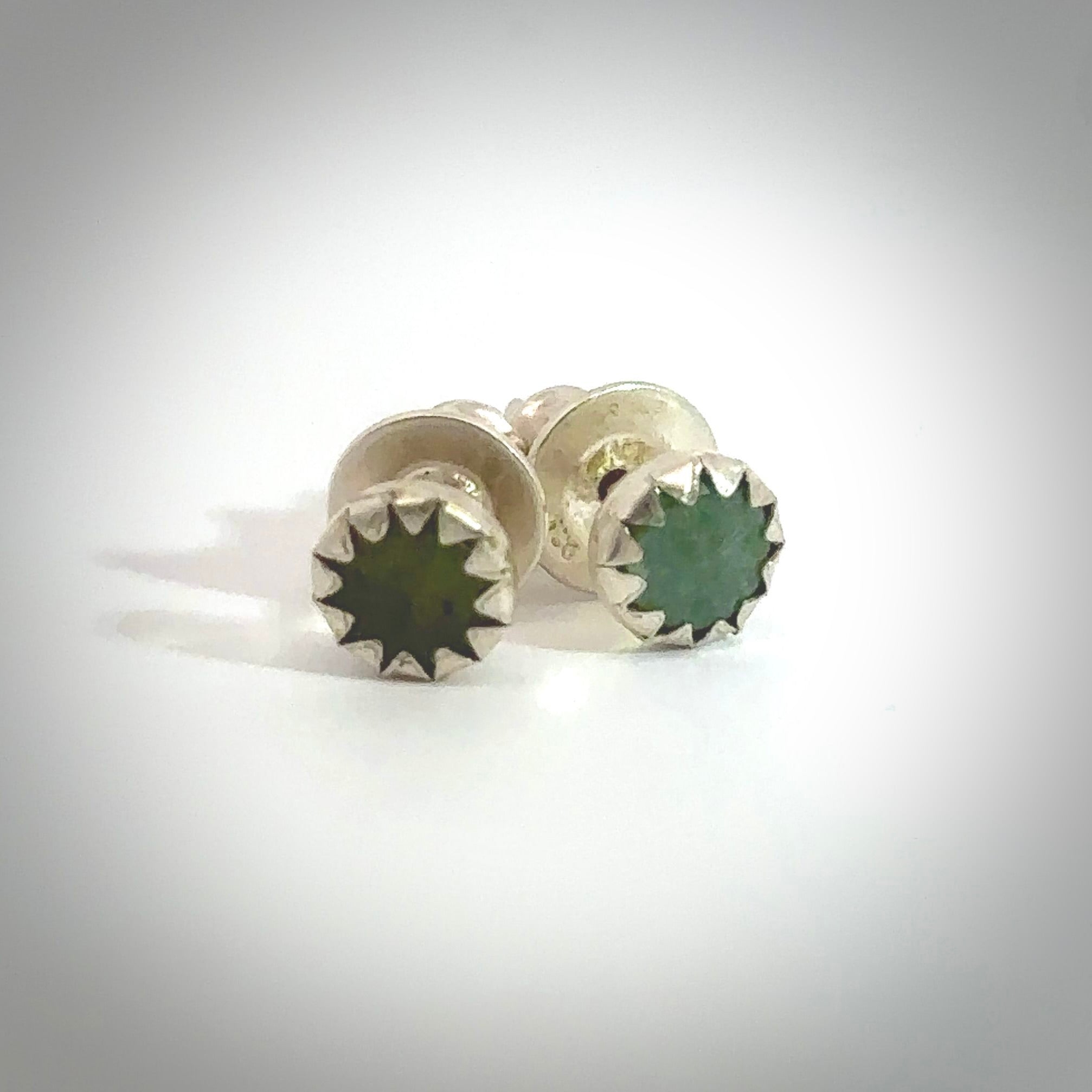 Hand carved small New Zealand Jade stud earrings. Made by NZ Pacific from NZ Garnet. Online jewellery for sale online by NZ Pacific.