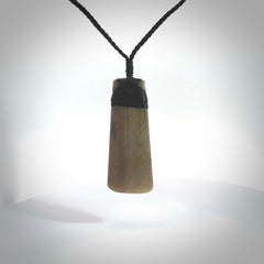 Hand carved toki pendant. Made from Marlin Bill by NZ Pacific. Hand carved marlin bill toki necklace. Handcrafted necklace. Unique gifts and Art to Wear by NZ Pacific.