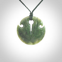 Green jade contemporary shield drop pendant hand carved for you by NZ Pacific. Hand carved jewellery made from jade and for sale online. One only pendant with adjustable green cord.