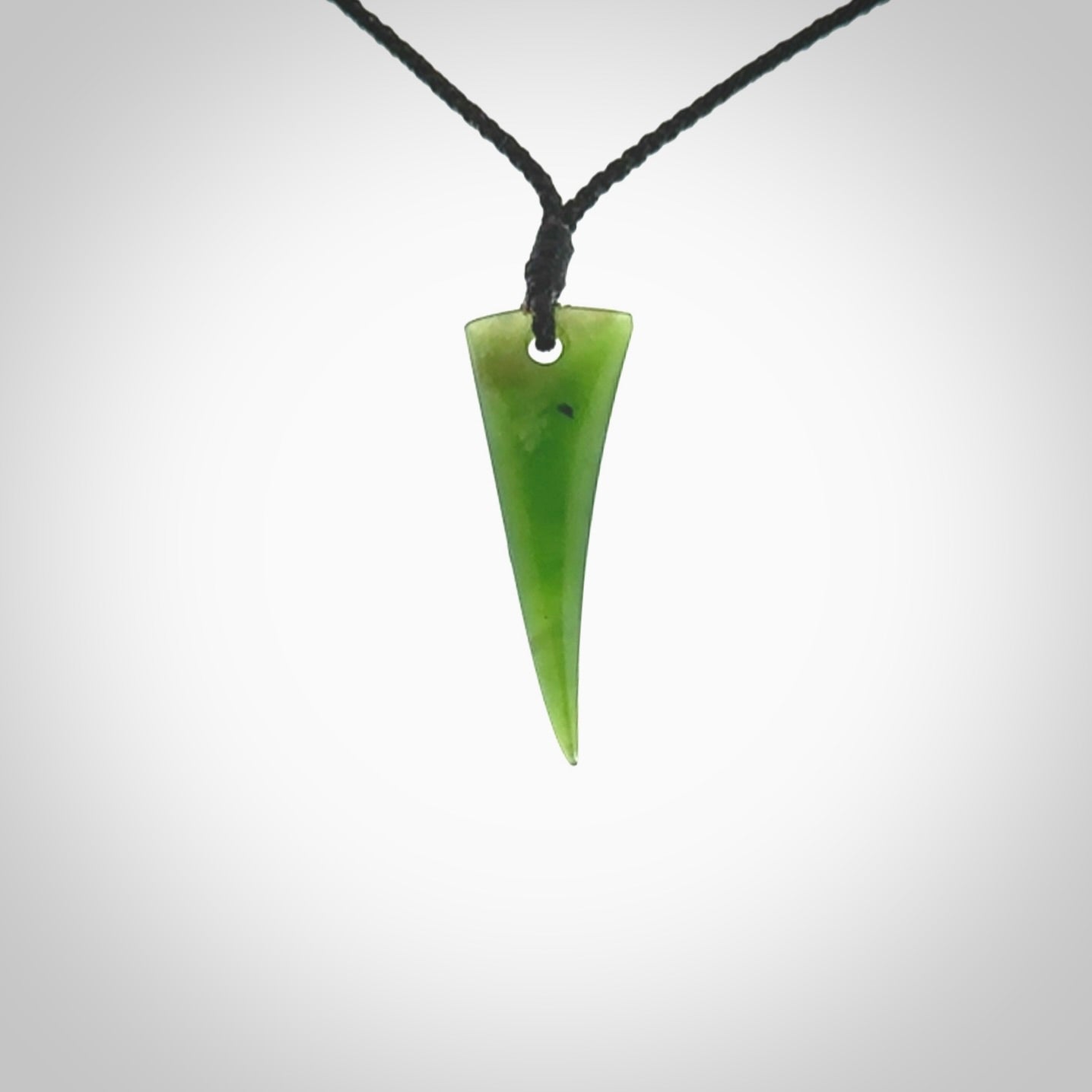 Hand carved pounamu drop pendant. Jade necklace hand made in New Zealand. A contemporary drop pendant carved from rare New Zealand jade. NZ Pacific jade jewellery for sale online.