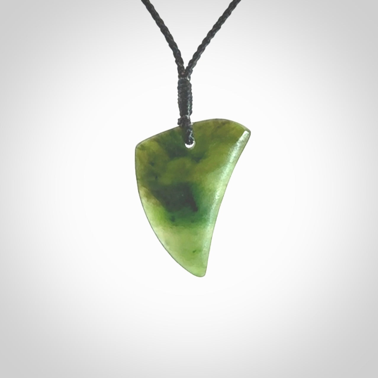 Hand carved pounamu drop pendant. Jade necklace hand made in New Zealand. A contemporary drop pendant carved from rare New Zealand jade. NZ Pacific jade jewellery for sale online.