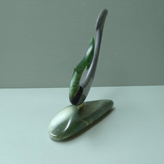 Hand carved large New Zealand Jade and Argillite Matau, hook carving displayed in a New Zealand Inanga Pounamu stand sculpture. Hand carved here in New Zealand by Kerry Thompson. This is a 'one only' sculpture, a beautiful display piece.