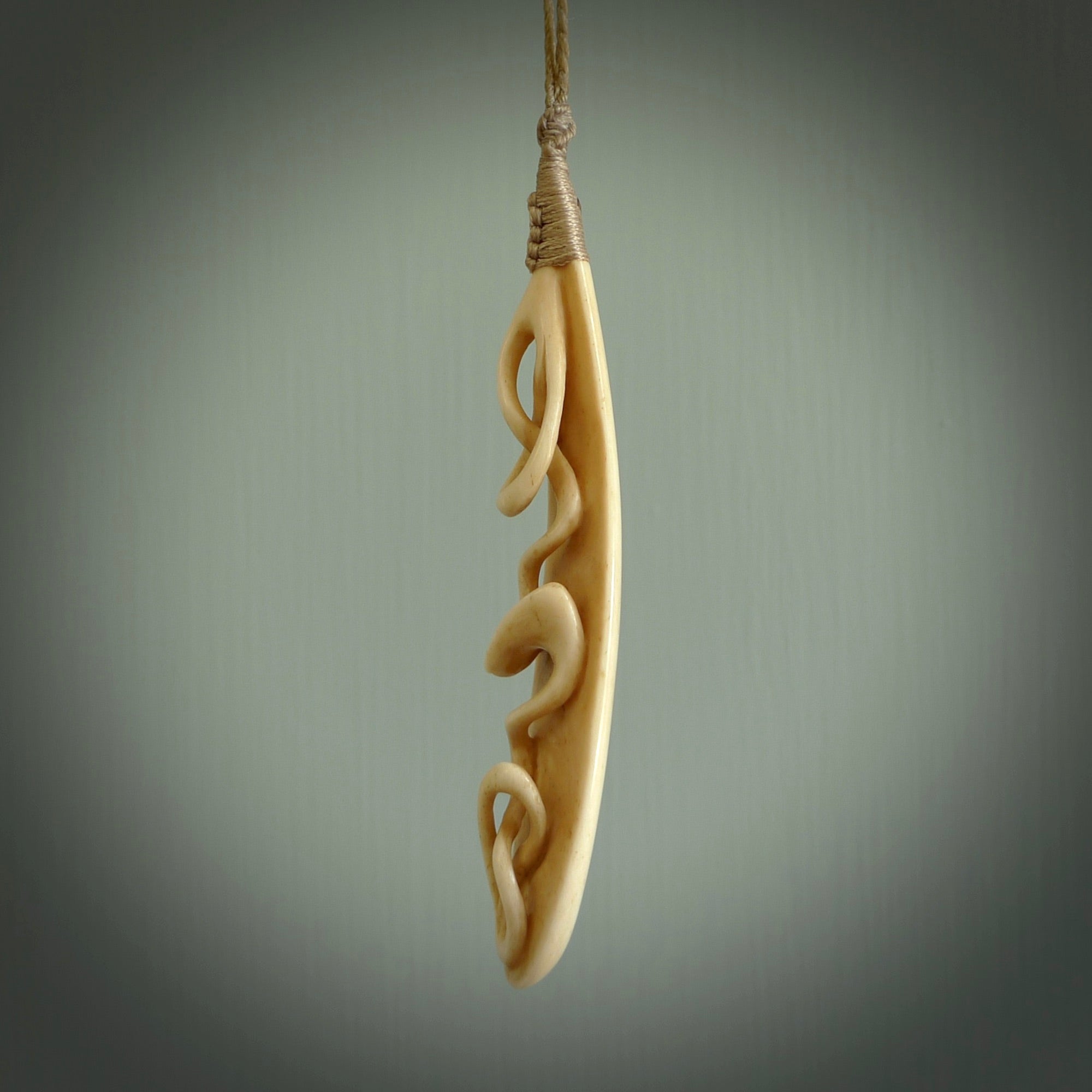 A handcarved masterpiece. A complex twist pendant carved from bone by Yuri Terenyi for NZ Pacific. This is a true piece of wearable art which is collectible. A one-off masterpiece and quite unique. Delivered with Express Courier and gift wrapped in a woven kete pouch.