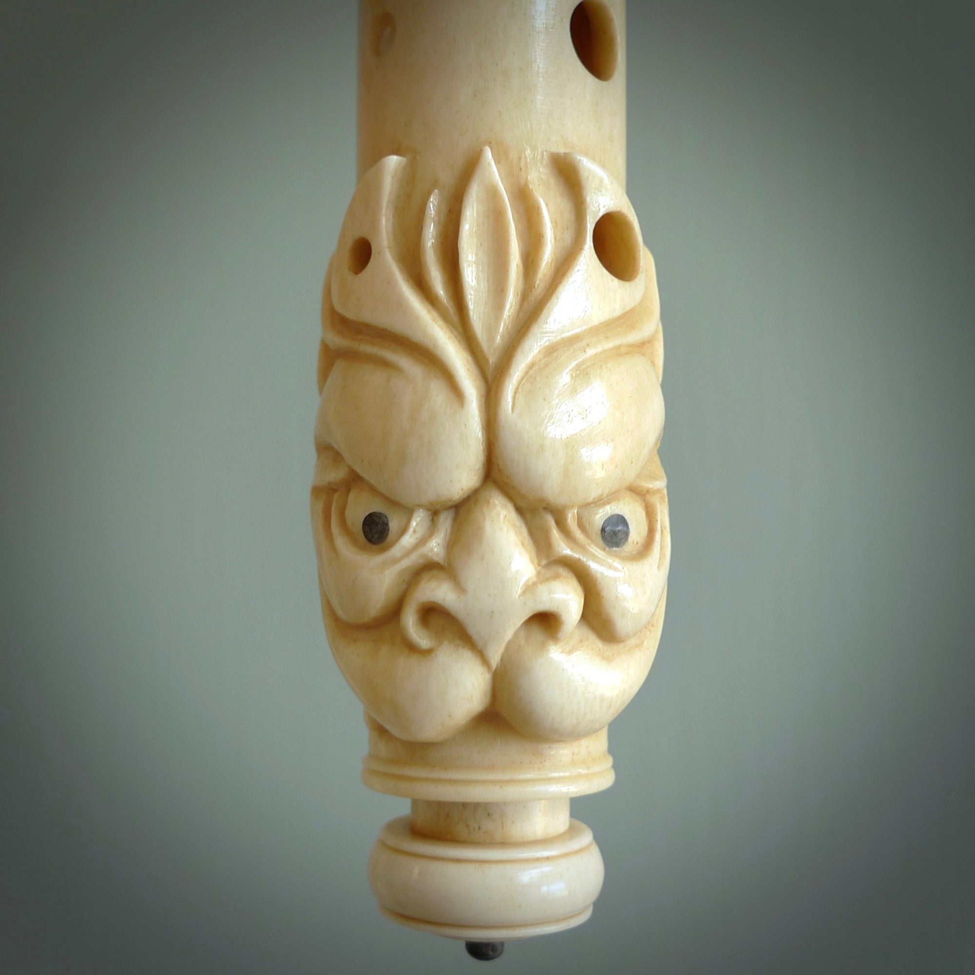 A contemporary hand carved flute. This piece is made from bone and is a fully functioning musical instrument and can be played. Beautiful art hand made by Yuri Terenyi. Flute with Dragons head.