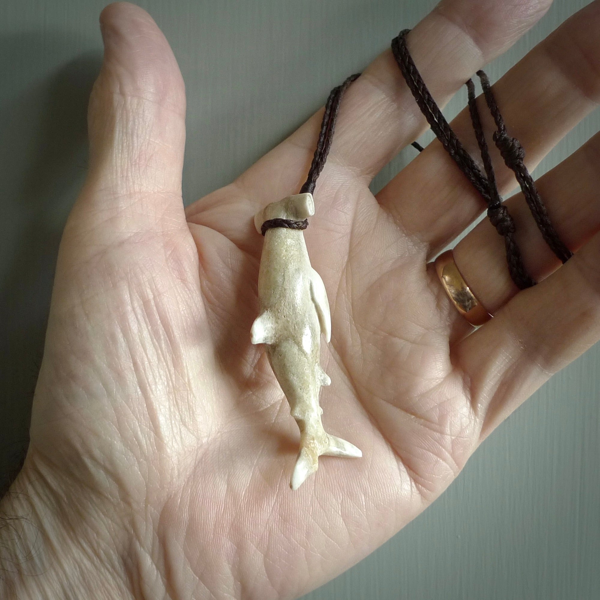 Winghead or hammerhead shark pendant. Handcarved from deer antler by NZ Pacific. Handcarved bone jewellery for sale online.