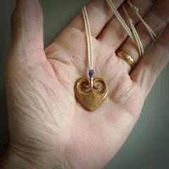 Hand carved heart pendant. Hand made from woolly mammoth tusk. Hand made jewellery for sale online. Rare and unique handmade jewellery. Made by NZ Pacific.