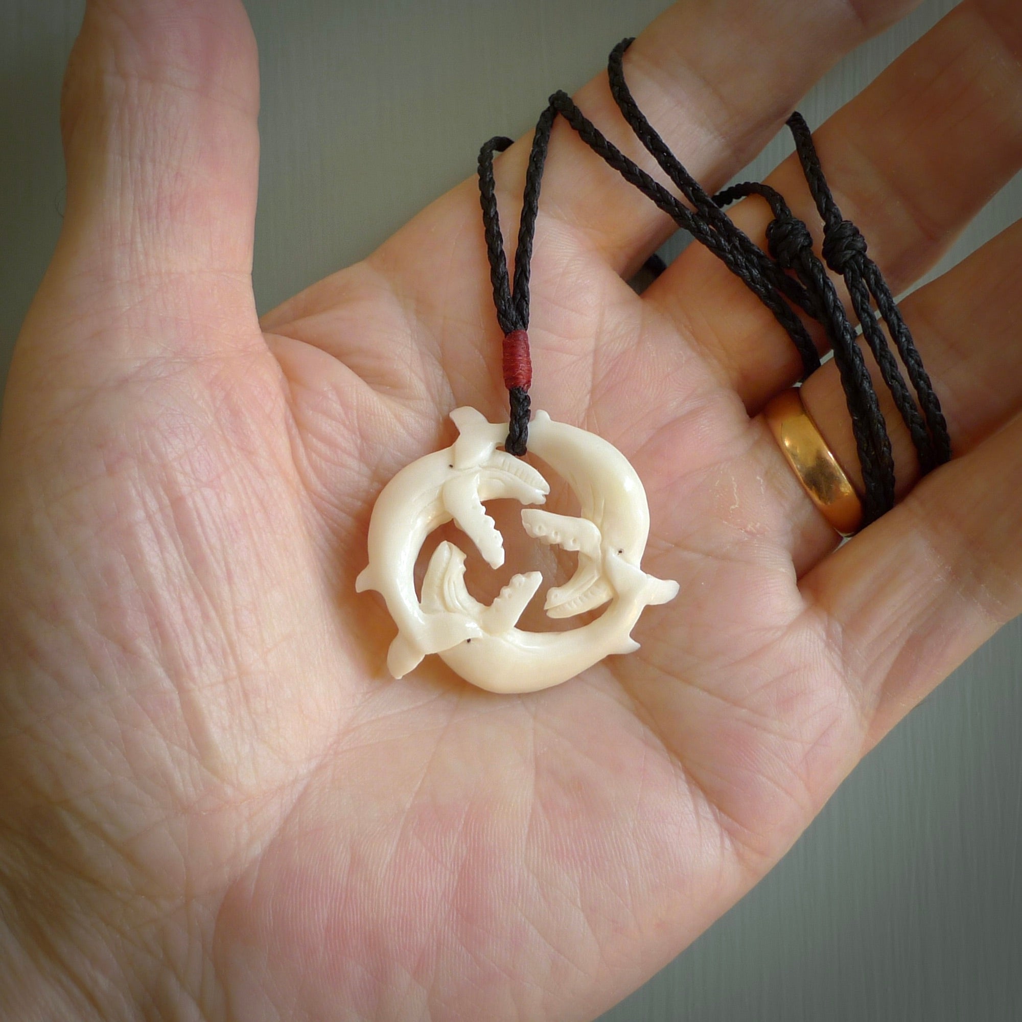 Hand carved natural bone whale trilogy pendant. Art to wear. Ocean themed pendants.