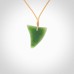 One only medium sized New Zealand jade drop pendant. Hand carved in New Zealand by Ric Moor, jade artist, for NZ Pacific. Provided with adjustable beige cord.