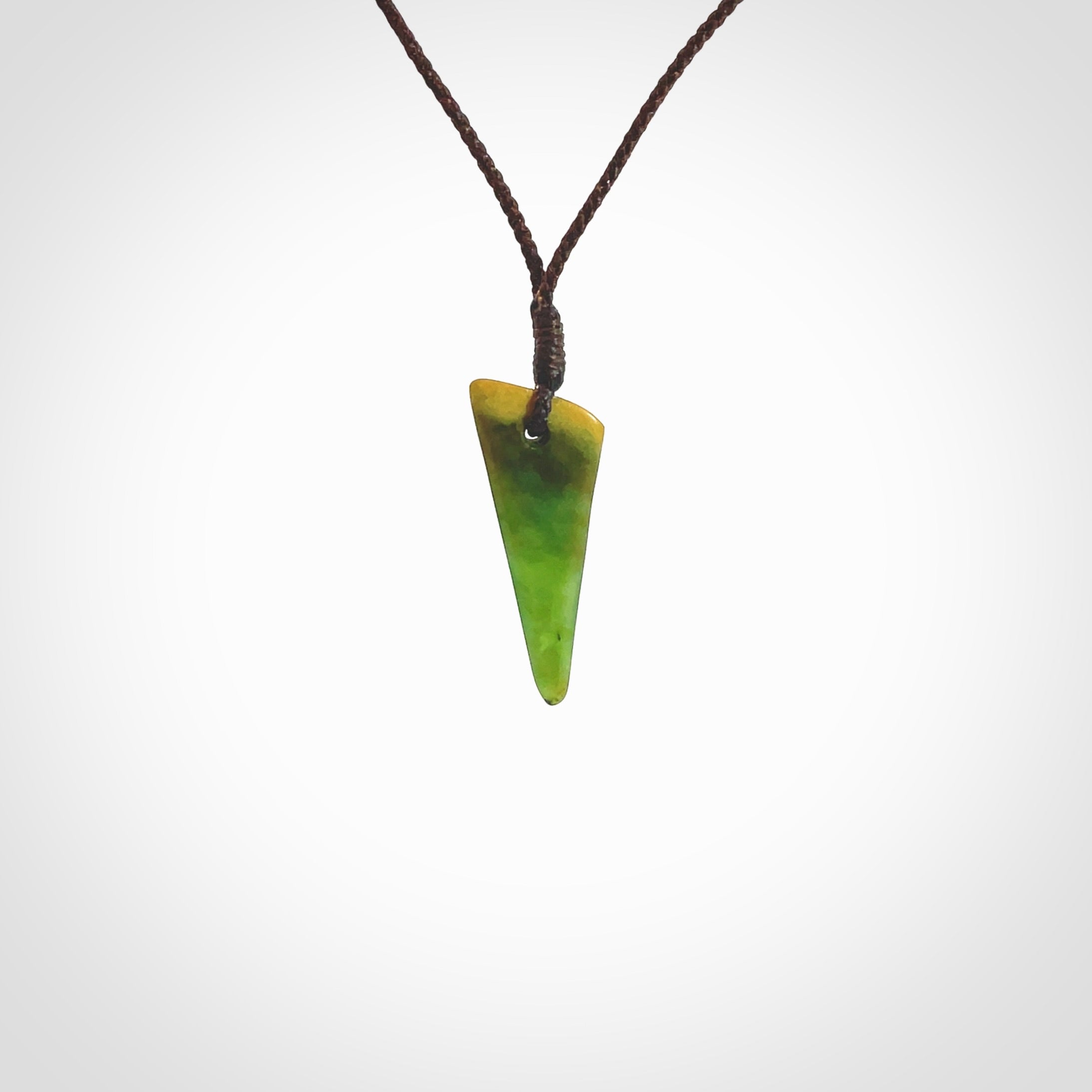 Hand carved medium sized pounamu drop pendant. Jade necklace hand made in New Zealand. A contemporary drop pendant carved from rare New Zealand jade. NZ Pacific jade jewellery for sale online.