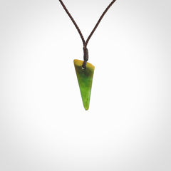 Hand carved medium sized pounamu drop pendant. Jade necklace hand made in New Zealand. A contemporary drop pendant carved from rare New Zealand jade. NZ Pacific jade jewellery for sale online.