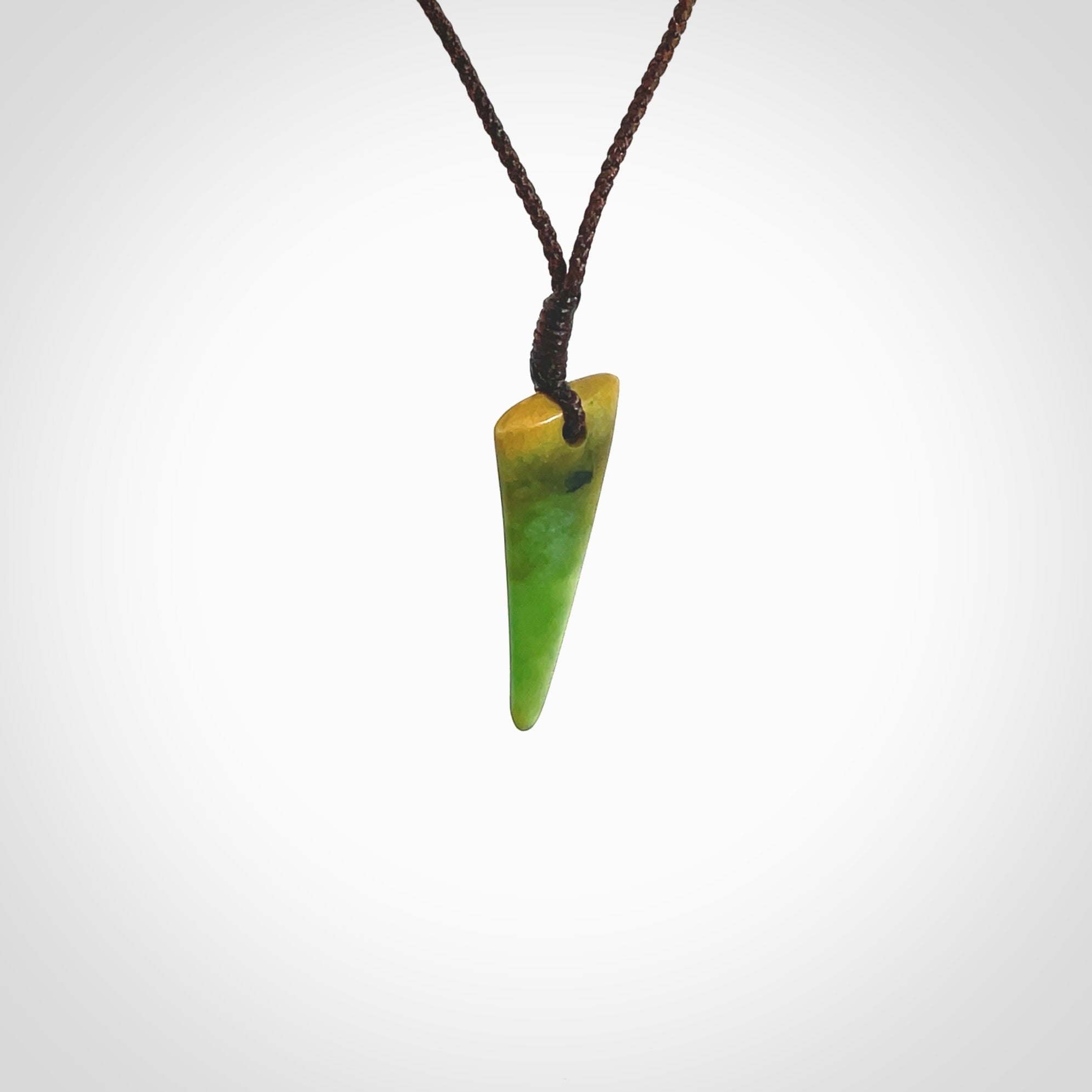 Hand carved medium sized pounamu drop pendant. Jade necklace hand made in New Zealand. A contemporary drop pendant carved from rare New Zealand jade. NZ Pacific jade jewellery for sale online.