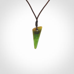 Hand carved medium sized pounamu drop pendant. Jade necklace hand made in New Zealand. A contemporary drop pendant carved from rare New Zealand jade. NZ Pacific jade jewellery for sale online.