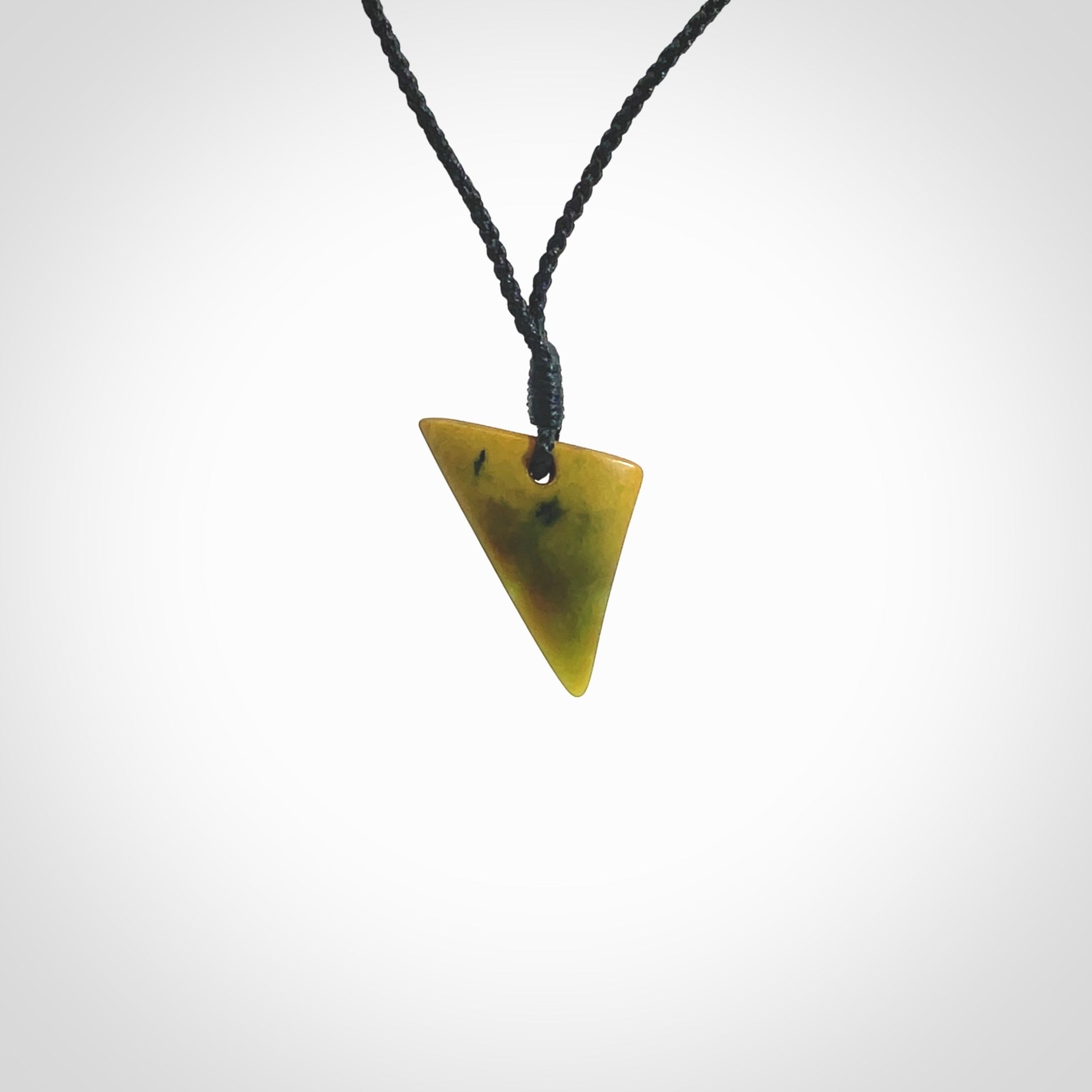 Hand carved small sized pounamu drop pendant. Jade necklace hand made in New Zealand. A contemporary drop pendant carved from rare New Zealand jade. NZ Pacific jade jewellery for sale online.