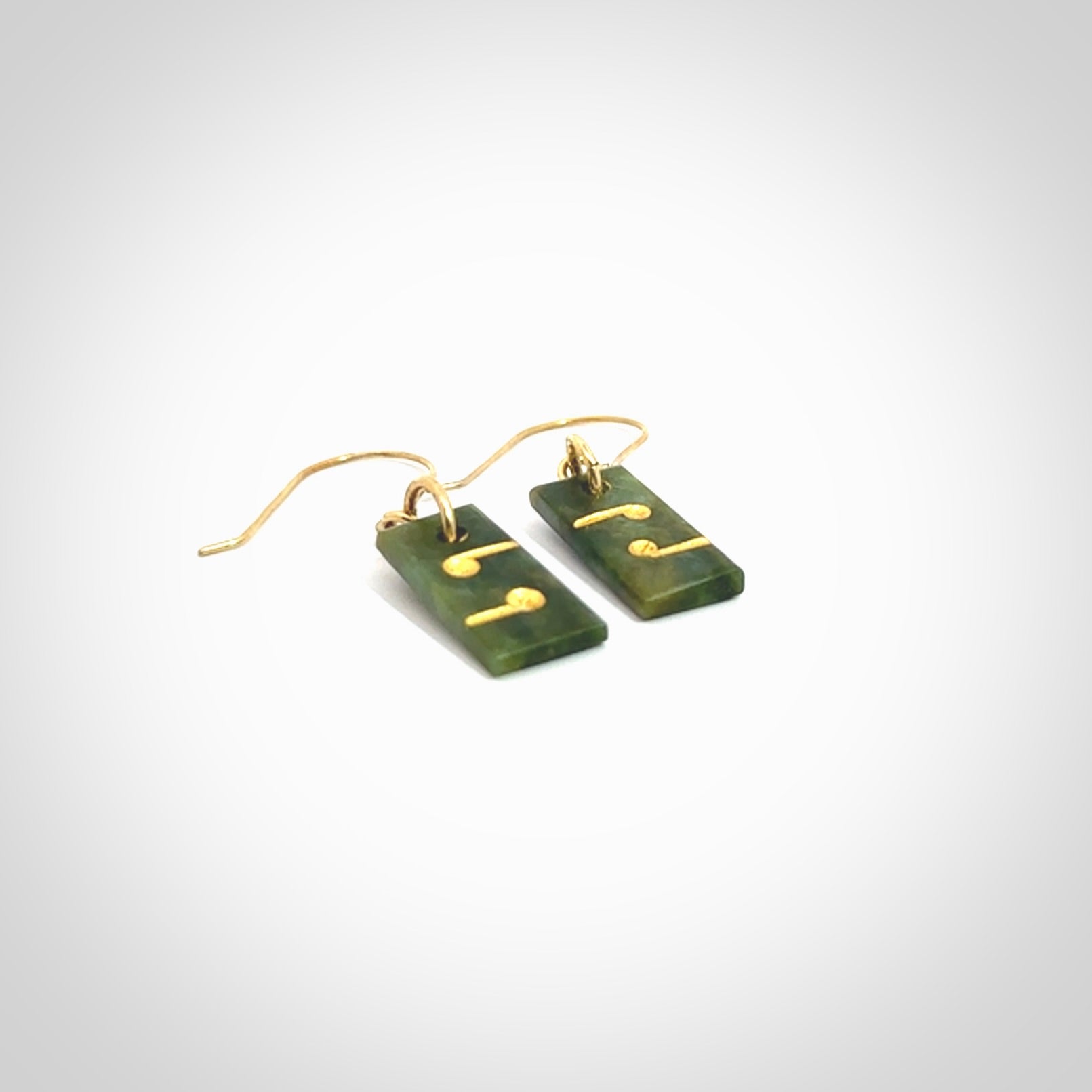 These small drop earrings are beautifully hand made with gorgeous flair. They are fashionable and perfect for a women with style. Hand carved from a gorgeous piece of New Zealand Marsden jade with Gold leaf and gold plated hooks - they are elegant and beautiful.