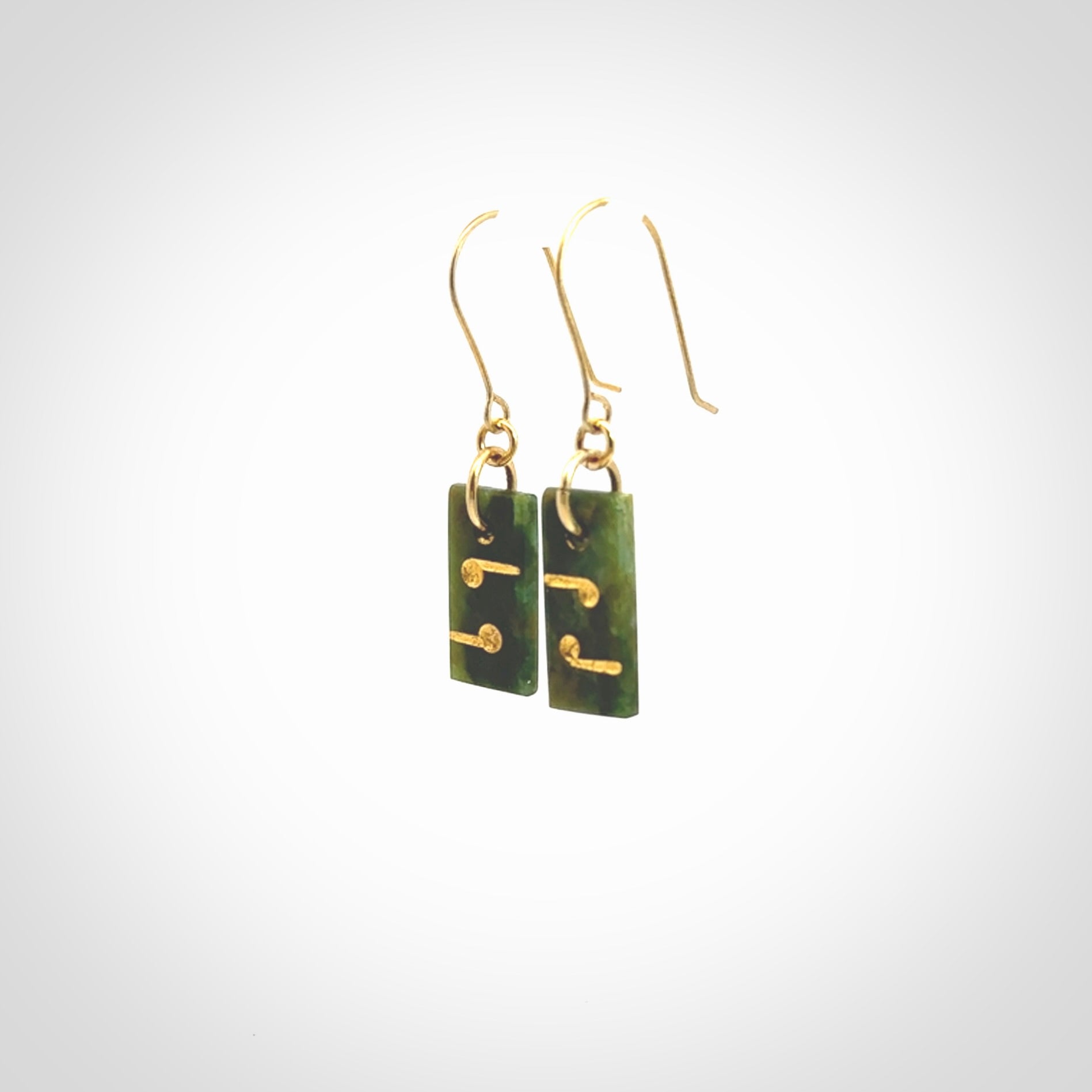 These small drop earrings are beautifully hand made with gorgeous flair. They are fashionable and perfect for a women with style. Hand carved from a gorgeous piece of New Zealand Marsden jade with Gold leaf and gold plated hooks - they are elegant and beautiful.