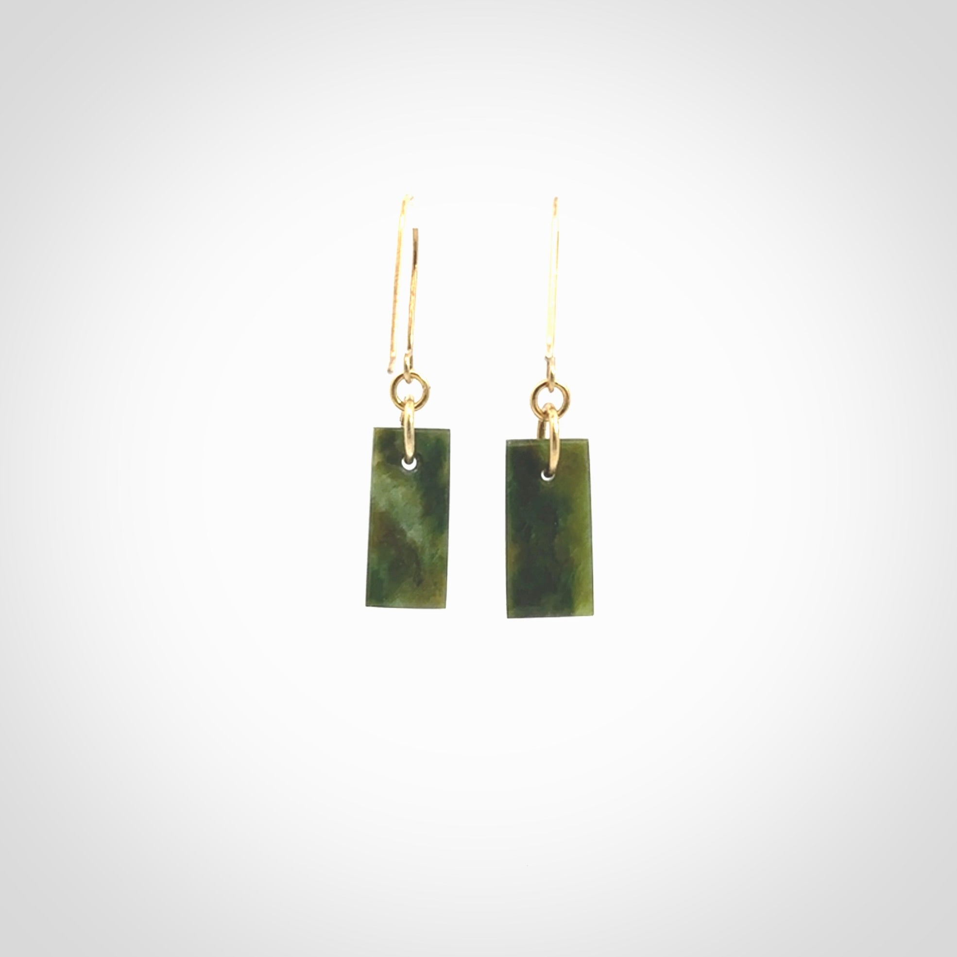 These small drop earrings are beautifully hand made with gorgeous flair. They are fashionable and perfect for a women with style. Hand carved from a gorgeous piece of New Zealand Marsden jade with Gold leaf and gold plated hooks - they are elegant and beautiful.