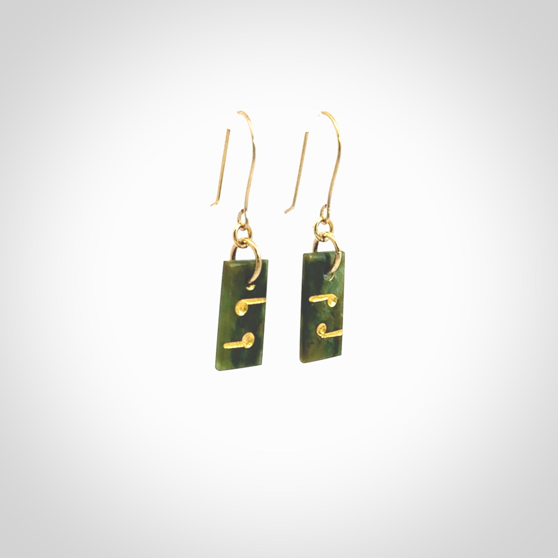 These small drop earrings are beautifully hand made with gorgeous flair. They are fashionable and perfect for a women with style. Hand carved from a gorgeous piece of New Zealand Marsden jade with Gold leaf and gold plated hooks - they are elegant and beautiful.