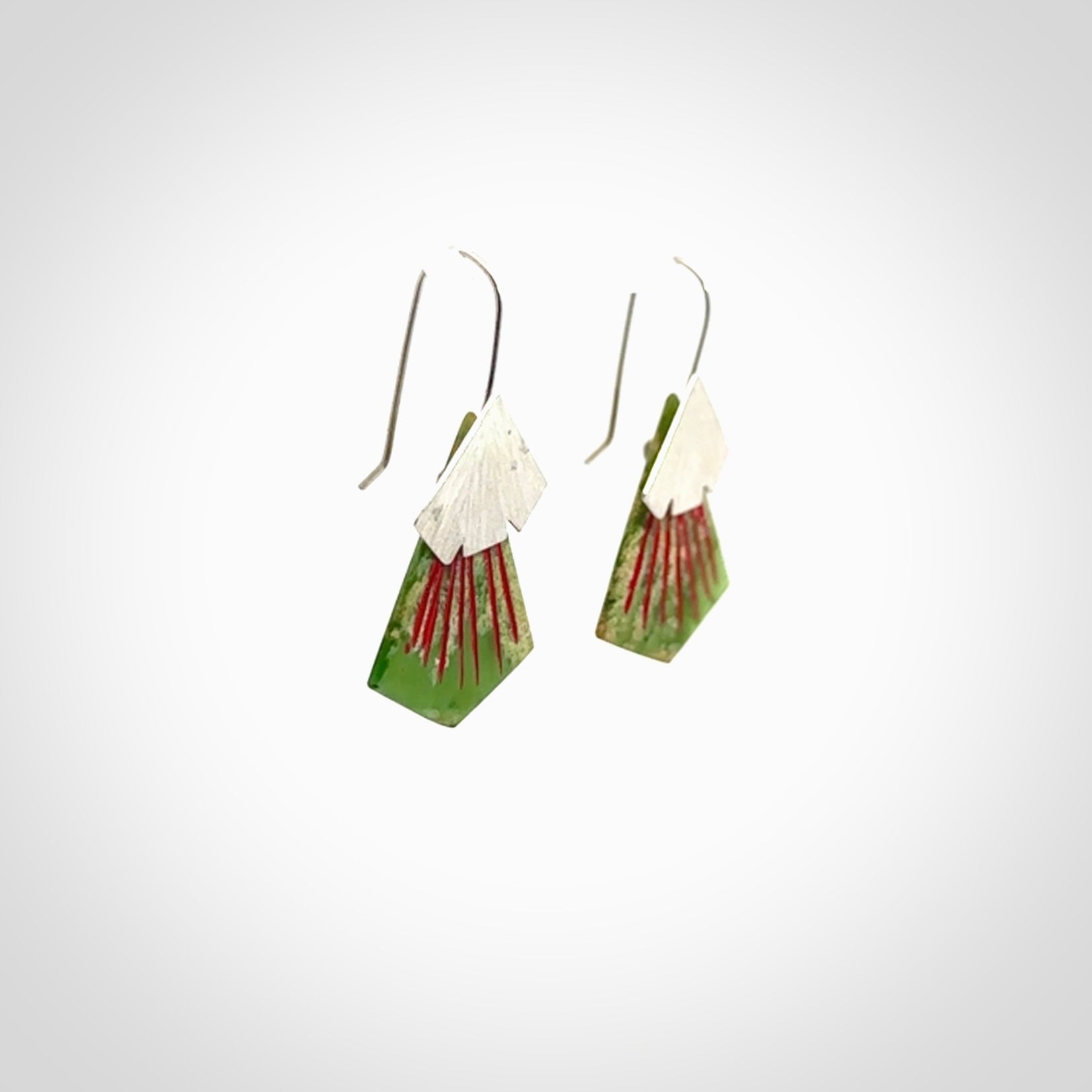 Hand made New Zealand Jade Rata drop earrings with sterling silver and red enamel. Hand crafted by Ana Krakosky. Beautiful Jade earrings hand made in New Zealand. One pair only. Provided in a woven kete pouch.