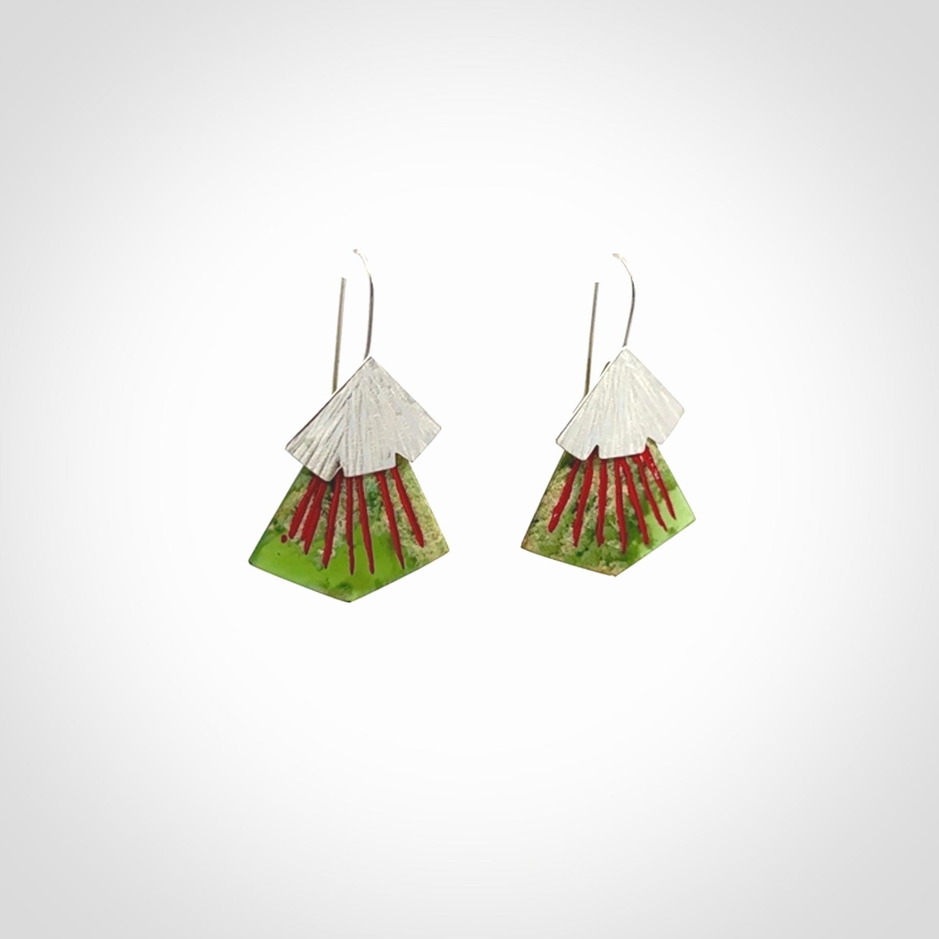 Hand made New Zealand Jade Rata drop earrings with sterling silver and red enamel. Hand crafted by Ana Krakosky. Beautiful Jade earrings hand made in New Zealand. One pair only. Provided in a woven kete pouch.